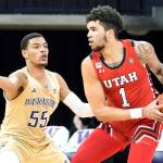 Utah forward Timmy Allen (1) tries to get around Washington guard Quade Green (55) during the first half of an NCAA college basketball game, Sunday, Jan. 24, 2021, in Seattle. (AP Photo/Ted S. Warren)
