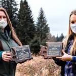 Nicole Rasmussen, water quality biologist for the Quileute Tribe (right), and Meghan Adamire, conservation planner for Clallam Conservation District, standing along the edge of the Quillayute River with the Hermison Road restoration project in the background. (Submitted photo)