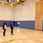 Mary Budke, executive director of the Boys & Girls Clubs of the Olympic Peninsula, left, and Janet Gray, resource development director, walk through the new gym at the Port Angeles Units new facility on Thursday. (Keith Thorpe/Peninsula Daily News)