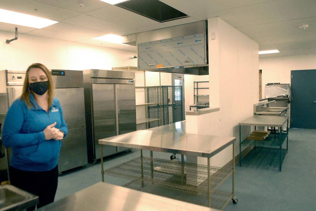 Janet Gray, resource development director for the Boys & Girls Clubs of the Olympic Peninsula, stands in the kitchen of the organizations new clubhouse in Port Angeles on Thursday. (Keith Thorpe/Peninsula Daily News)