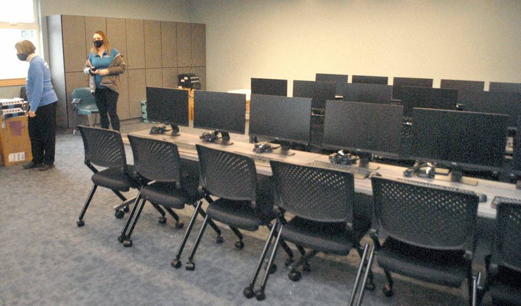 Boys & Girls Club board member Norma Turner, left, and Resource Development Director Janet Gray look over equipment the new computer room of the Port Angeles clubhouse. (Keith Thorpe/Peninsula Daily News)