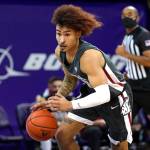 Washington State's Isaac Bonton drives against Washington in the first half of an NCAA college basketball game Sunday, Jan. 31, 2021, in Seattle. (AP Photo/Elaine Thompson)
