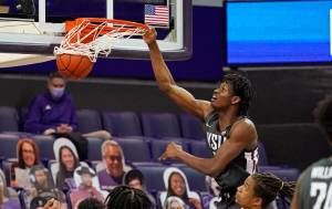 Washington States Efe Abogidi dunks against Washington in the first half of an NCAA college basketball game Sunday, Jan. 31, 2021, in Seattle. (AP Photo/Elaine Thompson)