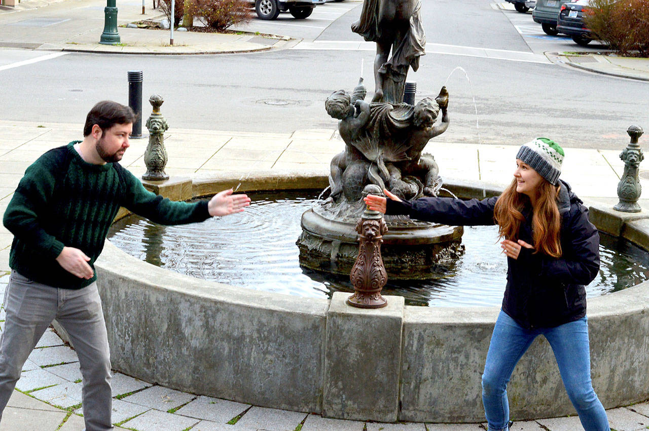 Key City Public Theatres Brendan Chambers and Maggie Jo Bulkley engage in a little zip zap zop, a theater game, in preparation for their youth theater classes in Port Townsend. The two are not wearing masks in this photo because they live in the same household. (Diane Urbani de la Paz/Peninsula Daily News)