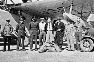 A USCG Douglas RD-4, post office truck and unidentified men gather at Cook’s Prairie, the location of the current William R. Fairchild International Airport in Port Angeles. (Courtesy of Bert Kellogg Collection/North Olympic Library System)