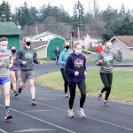 Dave Logan/for Peninsula Daily News
Port Angeles Roughrider cross country runners begin practicing Monday at the Port Angeles High School track. The first cross country meets are scheduled Saturday as prep sports slowly return to the Olympic Peninsula. Only cross country can begin competing at the moment but other sports are practicing in hopes of beginning in mid-February.