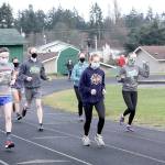 Dave Logan/for Peninsula Daily News Port Angeles Roughrider cross country runners begin practicing Monday at the Port Angeles High School track. The first cross country meets are scheduled Saturday as prep sports slowly return to the Olympic Peninsula. Only cross country can begin competing at the moment but other sports are practicing in hopes of beginning in mid-February.
