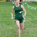 Lauren Larson of Port Angeles nears the finish line to win the girls cross country race at Lincoln Park in 2019. Larson, potentially a state-champion runner, gets a chance to lead her team back into competition Saturday after a nearly year-long hiatus of prep sports. (Keith Thorpe/Peninsula Daily News)