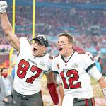 Tampa Bay Buccaneers tight end Rob Gronkowski (87), left, and Tampa Bay Buccaneers quarterback Tom Brady (12) celebrate together after the NFL Super Bowl 55 football game against the Kansas City Chiefs, Sunday, Feb. 7, 2021, in Tampa, Fla. The Tampa Bay Buccaneers defeated the Kansas City Chiefs 31-9. (AP Photo/Steve Luciano)