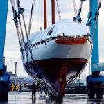 The Adventuress, a 108-year-old National Historic Landmark and nonprofit educational ship, was lifted into the Port Townsend Boat Haven on Monday morning. The schooner will receive its routine Coast Guard hull inspection and have its bottom painted. (Diane Urbani de la Paz/Peninsula Daily News)