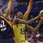 Seattle Storm forward Natasha Howard, right, drives past Phoenix Mercury center Brittney Griner (42) during the first half of a WNBA basketball game in Phoenix on Sept. 3, 2019. The New York Liberty acquired Natasha Howard from the Seattle Storm as part of a three-team trade on Wednesday. (Ross D. Franklin/The Associated Press file photo)