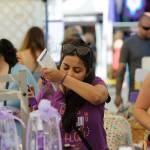 Rashi Jain of Seattle smells some lavender products in the Let's Do Lavender booth at the Lavender Festival Street Fair in July 2019. This summer will be the second consecutive time the novel coronavirus pandemic has led organizers to cancel the Street Fair in Carrie Blake Community Park. Matthew Nash/Olympic Peninsula News Group