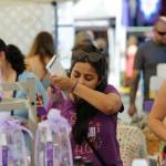 Rashi Jain of Seattle samples lavender products in the Lets Do Lavender booth at the Lavender Festival Street Fair in July 2019. This summer will be the second consecutive time the novel coronavirus pandemic has led organizers to cancel the Street Fair in Carrie Blake Community Park. (Matthew Nash/Olympic Peninsula News Group)