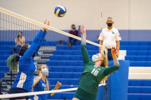 Steve Mullensky/for Peninsula Daily News

Port Angeles' Kennedy Bruch, 10, defends the net against East Jefferson Volleyball Team of Katie Ballard, left, and Sophie Patterson during a Tuesday game in Chimacum.