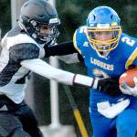 Keith Thorpe/Peninsula Daily News
Crescent's Brenten Dalton, right, tries to evade Lummi Nation's Jaie Leighton during Satuday's matchup in Joyce.