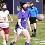 Michael Dashiell/Olympic Peninsula News Group
Sequim midfielder Abby Schroeder, center, vies with Kingston Buccaneer Mandy Dormaier as they chase down a ball in the first half of Sequim's 2-1 win over Kingston on Feb. 18.