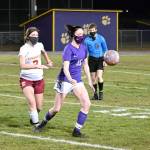 Michael Dashiell/Olympic Peninsula News Group Sequim midfielder Abby Schroeder, center, vies with Kingston Buccaneer Mandy Dormaier as they chase down a ball in the first half of Sequims 2-1 win over Kingston on Feb. 18.