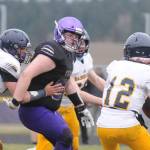 Sequim defensive lineman Caleb Pozernick pressures the Bainbridge quarterback during the Wolves 38-0 win Saturday. Sequim forced seven turnovers, including five interceptions, on defense.
Michael Dashiell/Olympic Peninsula News Group
