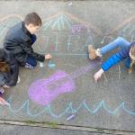 Warming up for Saturday's "Chalk It Up!" event are Cate Chance, 11, left, Lucas Chance, 7, and Sarah Butterworth, 10, all of Port Angeles. (Photo courtesy Juan de Fuca Foundation for the Arts)