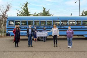 Windermere Real Estate/Sequim-East recently donated $1,500 to the Boys & Girls Clubs of the Olympic Peninsula through the Windermere Foundation. The club served 1,258 youth members and an additional 2,945 youths through outreach programs. During the COVID-19 pandemic, the club set up remote learning support centers, provided free wi-fi and delivered 54,000 free healthy meals to low-income families. Pictured, left to right, are: Dollie Sparks and Alan Burwell, presenting the donation to Janet Gray and Tessa Jackson. Cole Tate and T.J. Rooke are in the back row.