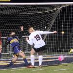 Forks Candida-Rose Sandoval, second from left, clears the ball away from the Spartans net between Ocosta players while Forks goalkeeper Katelynn Wallerstedt looks on. (Lonnie Archibald/for Peninsula Daily News)