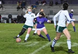 Michael Dashiell/Olympic Peninsula News Group
Port Angeles' Anna Petty, left, is defended by Sequim's Natalya James as Petty passes to teammate Bailee Larson.