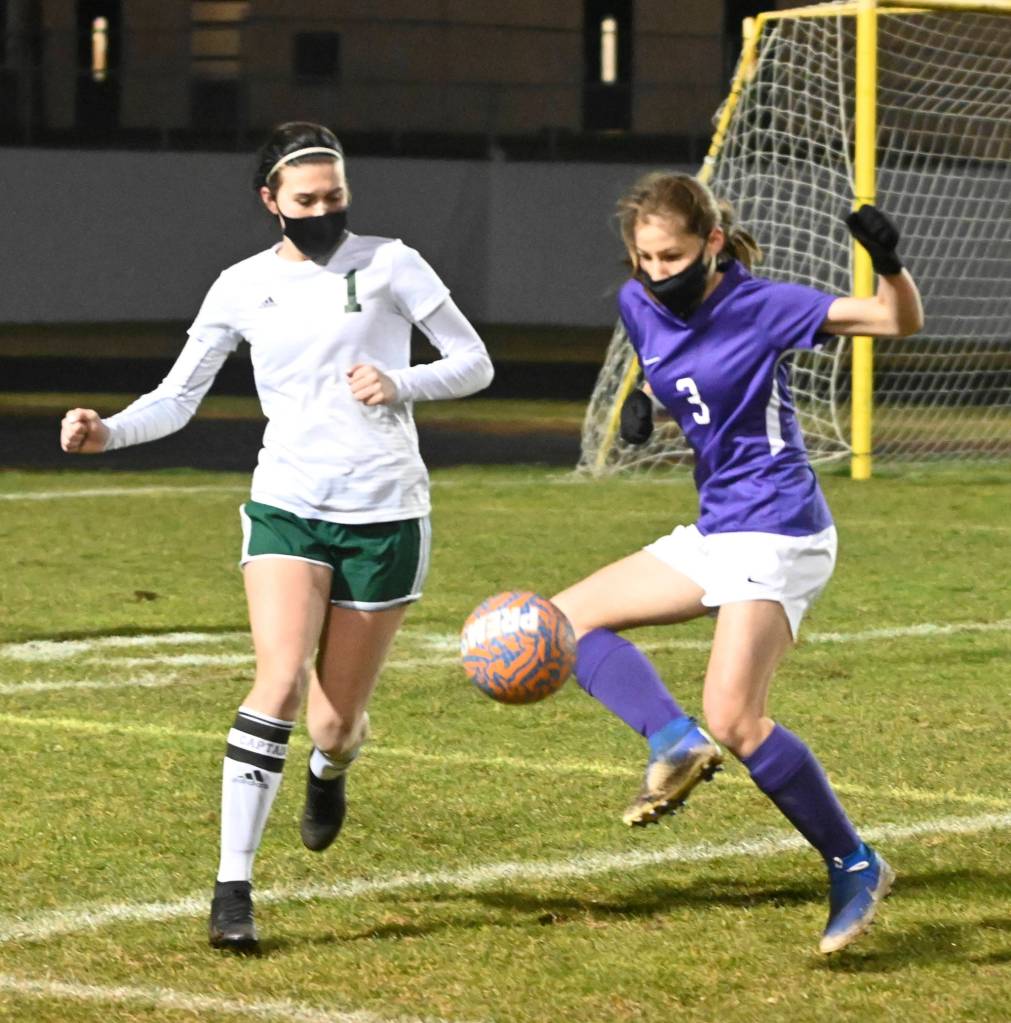 Port Angeles Bailee Larson, left, and Sequims Taryn Johnson vie for a loose ball during the second half of the Roughriders 2-1 win over the Wolves on Friday.
Michael Dashiell/Olympic Peninsula News Group