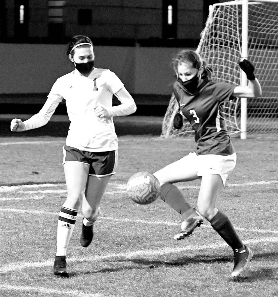 <strong>Michael Dashiell</strong>/Olympic Peninsula News Group
Port Angeles Bailee Larson, left, and Sequims Taryn Johnson vie for a loose ball during the second half of the Roughriders 2-1 win over the Wolves on Friday.