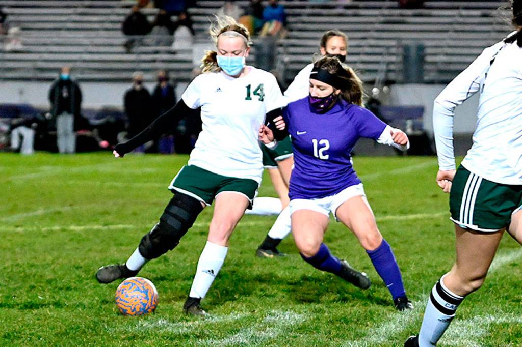 Michael Dashiell/Olympic Peninsula News Group
Port Angeles' Anna Petty, left, is defended by Sequim's Natalya James as Petty passes to teammate Bailee Larson.