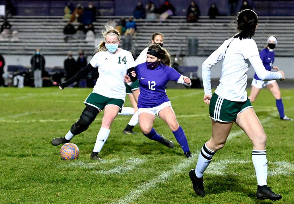 Michael Dashiell/Olympic Peninsula News Group
Port Angeles' Anna Petty, left, is defended by Sequim's Natalya James as Petty passes to teammate Bailee Larson.