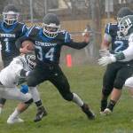 Logan Massie of East Jefferson is surrounded by Port Angeles Kameron Meadows, left, and Jacob Felton, right, as Massie is backed up by teammates Hunter Cerna, left rear and Anton Jones on Saturday in Port Angeles. (Keith Thorpe/Peninsula Daily News)