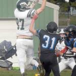 Cyras Mills of Port Angeles goes for a pass while defended by East Jeffersons Nathan Nisbet at Stevens Middle School in Port Angeles on Saturday. (Keith Thorpe/Peninsula Daily News)
