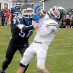 Port Angeles Derek Sparks catches a pass over the defense of East Jeffersons Toby Fulton on Saturday in Port Angeles. (Keith Thorpe/Peninsula Daily News)