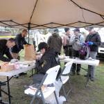<address>Investigators from the Clallam County Sheriffs Office and other agencies examine evidence collected on Friday from a residence on Lower Elwha Road west of Port Angeles where a suspect in Decembers triple homicide was arrested on Thursday. (Keith Thorpe/Peninsula Daily News)</address>