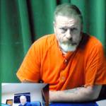 <strong>Keith Thorpe</strong>/Peninsula Daily News
Dennis Bauer makes his first video appearance in Clallam County Superior Court in Port Angeles on Friday after he was arrested Thursday.