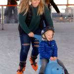 Chloie Sparks of Sequim pushes Charlie Reno, 3, around the rink during the opening hours of the Winter Ice Village in downtown Port Angeles in November 2019. (Keith Thorpe/Peninsula Daily News)