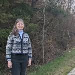 Jaimie Maciejewski, executive director of Habitat for Humanity of East Jefferson County, stands at property destined to be developed for 20 homes on Landes Street in Port Townsend. (Zach Jablonski/Peninsula Daily News)