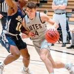 Ally Downey/Pacific Lutheran University Athletics
Pacific Lutheran guard Grayson Peet drives during a game earlier this season. The 2017 Port Angeles grad sank two 3-point baskets in a win over rival Puget Sound on Saturday.