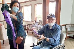 Sinclair Place resident Martin Arnold cuts the ribbon to mark the start of the the senior living facility’s Freedom Ceremony. 

The ceremony marks the fact that 100 percent of the residents have been vaccinated which allows the facility to ease rules regarding movement out into the community. 

Pictured on the left is Victorya Rivera, community relations manager at Sinclair Place.
