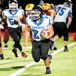 East Jefferson's Anson Jones (24) looks for running room against the Kingston defense Friday night. Jones rushed for 92 yards as Kingston won 12-7.  (Mark Krulish/Kitsap News Group)