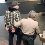 David Allen of Forks is led away to the Clallam County jail Wednesday to await sentencing after pleading guilty to two counts of child rape. (Paul Gottlieb/Peninsula Daily News)