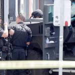FILE - In this June 6, 2014, file photo, Seattle Police SWAT team officers stand behind an armored vehicle in Seattle's Capitol Hill neighborhood. Lawmakers are on the cusp of overhauling policing and police accountability in Washington state, acting with unusual urgency to curb bad behavior by officers following last year's turbulent protests for racial justice. (AP Photo/Ted S. Warren, File)