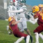 Port Angeles Ty Bradow, center, tries to evade the defense of Kingstons Cade Claymore, left, and Noah Walter on Saturday at Stevens Middle School in Port Angeles. (Keith Thorpe/Peninsula Daily News)