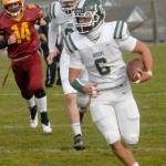 Port Angeles Jaziel Livingston rushes for yardage while pursued by Kingstons Lief Nelson, left, and teammate Jake Jacobsen on Saturday at Stevens Middle School. (Keith Thorpe/Peninsula Daily News)