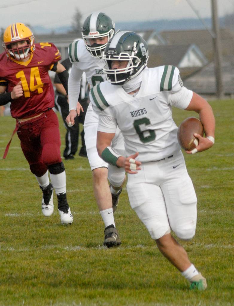 Port Angeles Jaziel Livingston rushes for yardage while pursued by Kingstons Lief Nelson, left, and teammate Jake Jacobsen on Saturday at Stevens Middle School. (Keith Thorpe/Peninsula Daily News)