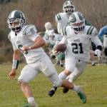Port Angeles Daniel Cable, center, runs downfield as teammate Jaziel Livingston, left, runs interference while Parker Nickerson looks on from behind on Saturday in Port Angeles. (Keith Thorpe/Peninsula Daily News)