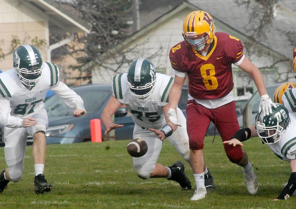 Port Angeles Treyton Walde, center, dives for a ball dropped by Kingstons Daniel Afton as Waldes teammates, Cyras Mills, left, and Aaron Edmiston, right, follow suit on Saturday at Stevens Middle School. (Keith Thorpe/Peninsula Daily News)