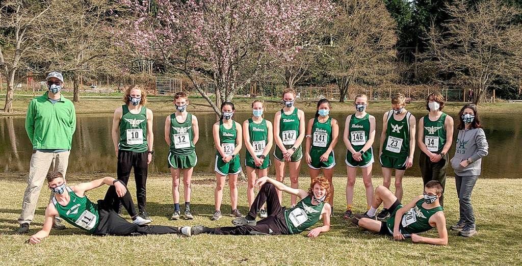 The Port Angeles boys and girls cross country teams pose after the Olympic League cross country championship. The boys team won the league title while Port Angeles Lauren Larson won the girls race.
