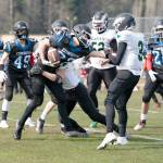 East Jeffersons Bjorn Danaan-Devas hangs on to the ball while being tackled by a player from the Klahowya Eagles during a Saturday afternoon home game in Chimacum. Klahowya won 41-6. (Steve Mullensky/for Peninsula Daily News)