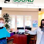 Danette Grady, on left, receives a $350 donation from Shelli Robb Kahler, vice-president of Sound Community Bank’s Sequim Village and Sequim Creekside branch offices, to assist with the care of rescued animals at the Peninsula Friends of Animals’ cageless, no-kill shelter. 

Grady is the executive director of the animal welfare organization.